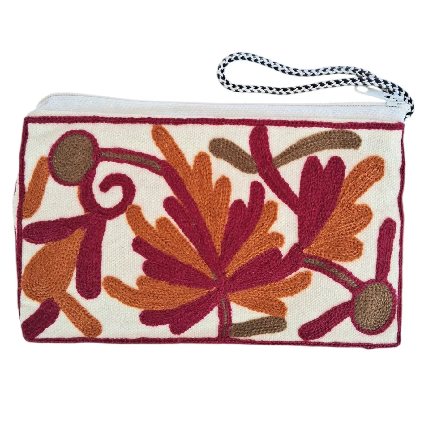 White pouch with colorful floral embroidery in maroon, orange, and brown, featuring a black and white braided zipper pull