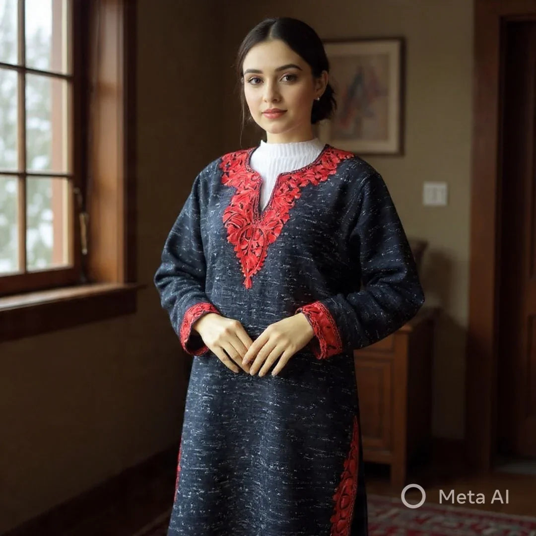 Woman wearing black traditional dress with red floral embroidery standing indoors near window
