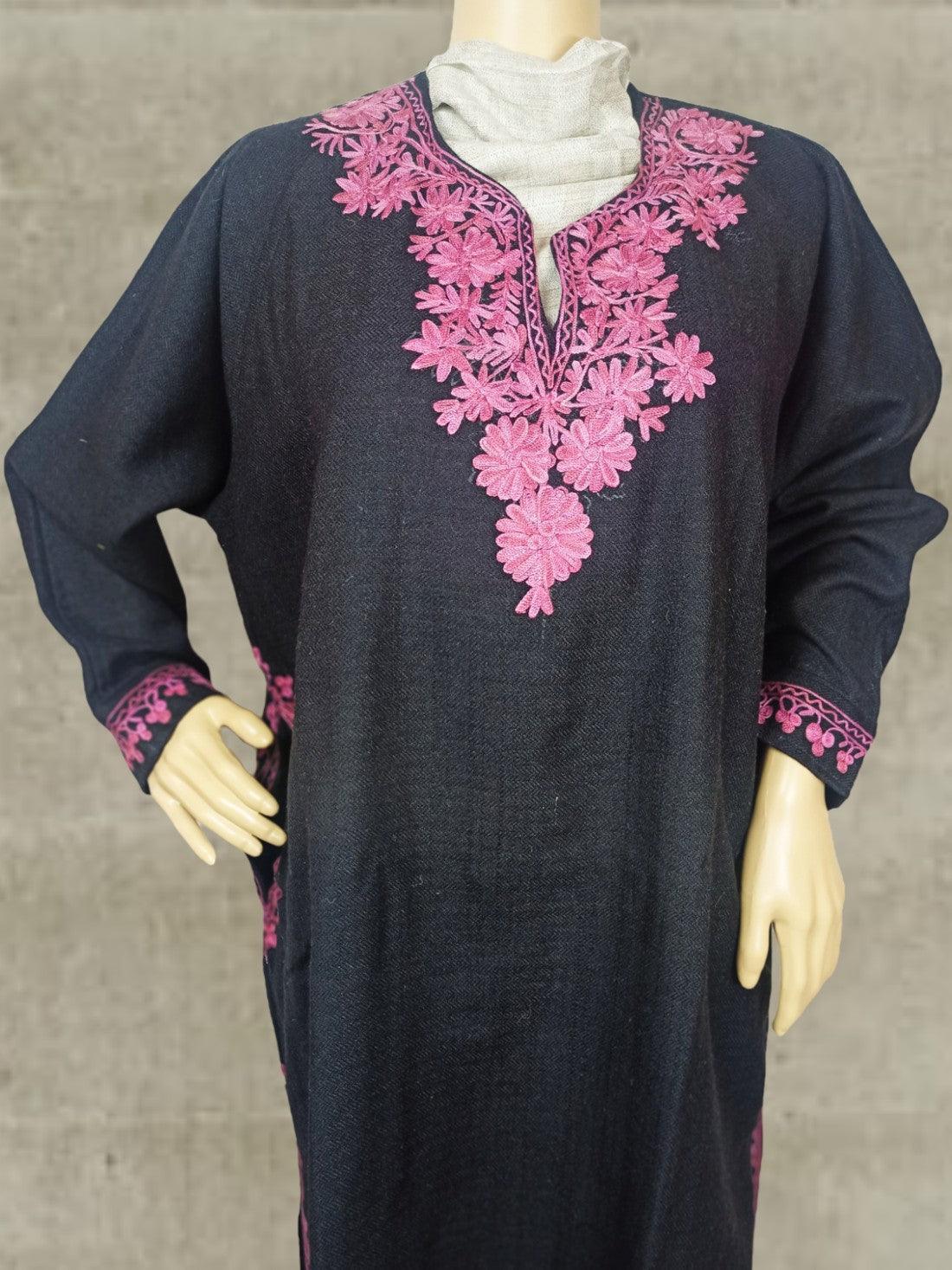 Black traditional dress with pink floral embroidery on neckline and cuffs displayed on mannequin