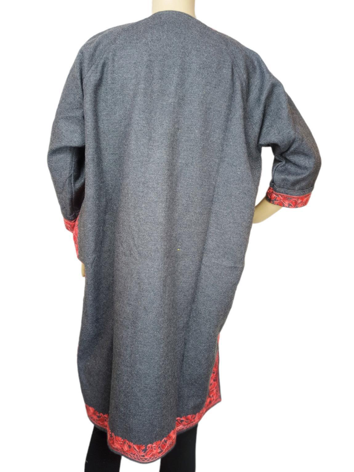 Back view of grey woolen coat with red embroidered cuffs and hem, displayed on mannequin