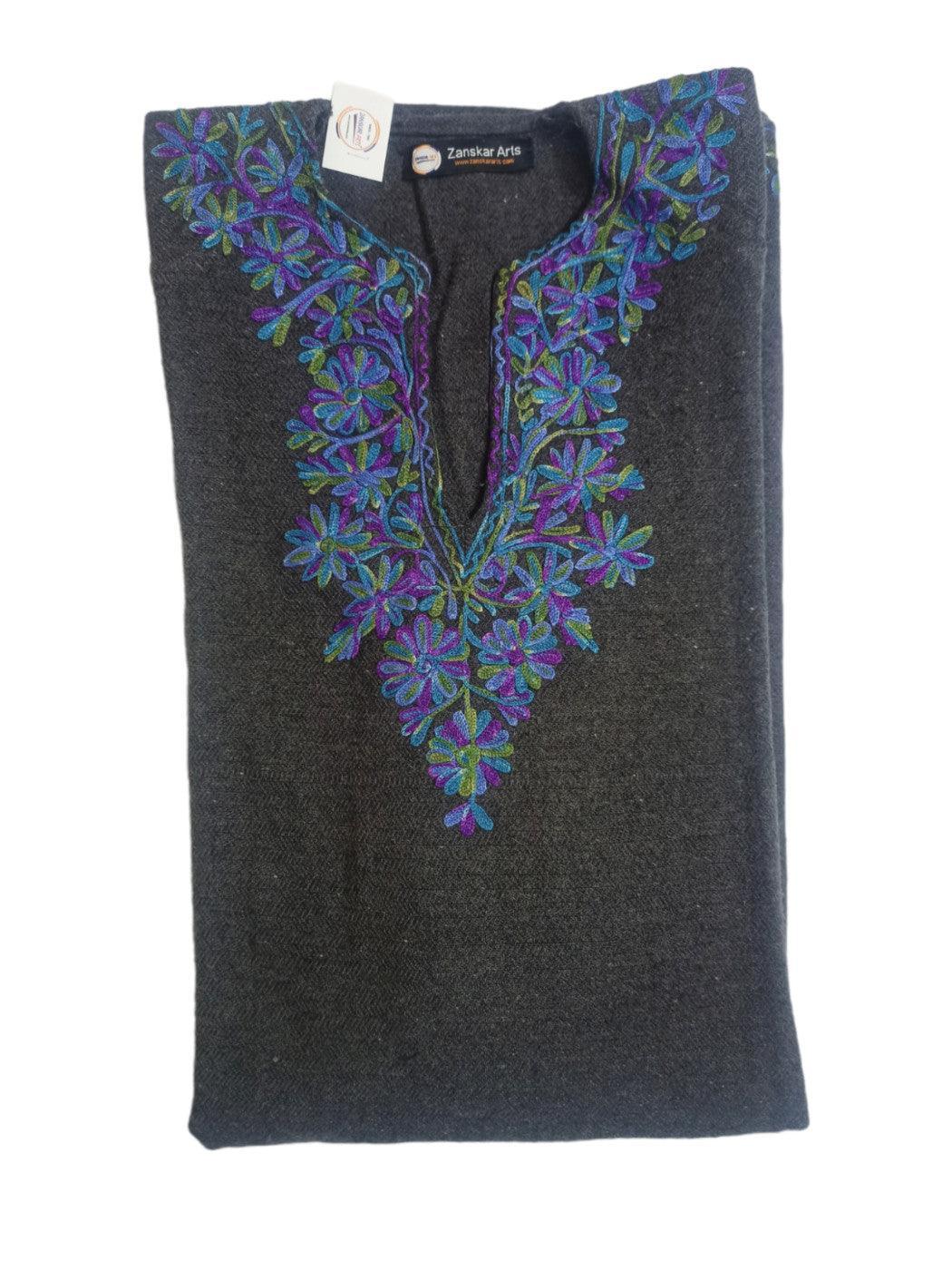 Folded dark grey woolen shawl with blue and purple floral embroidery on neckline by Zanskar Arts
