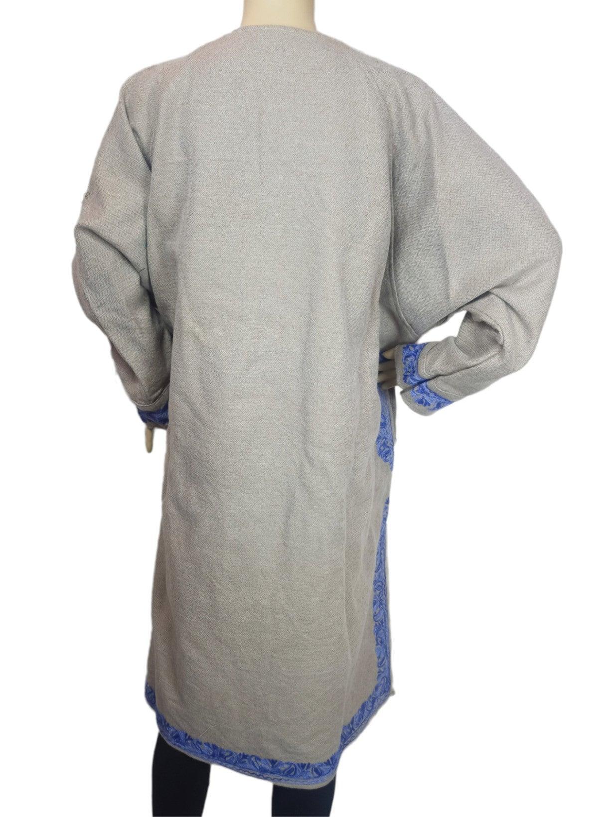 Back view of beige woolen long coat with blue embroidered borders on cuffs and hem