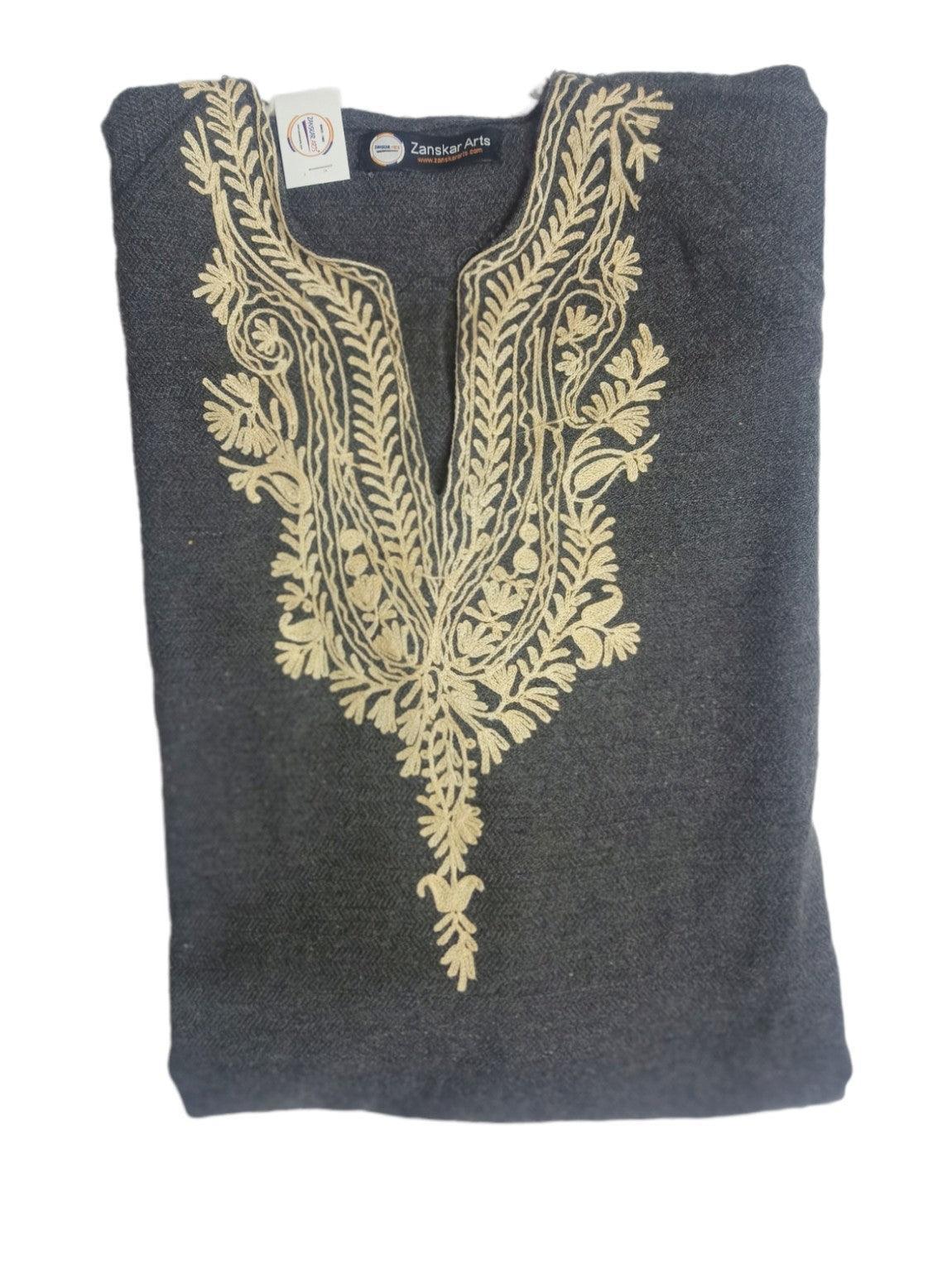 Folded dark gray woolen garment with intricate beige floral embroidery around neckline from Zanskar Arts