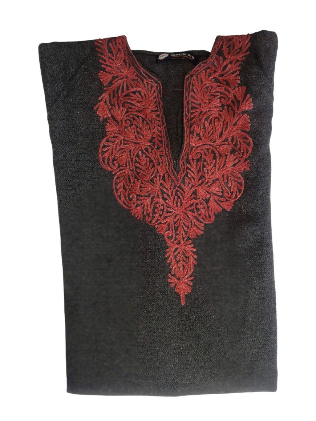 Folded black wool kurta with intricate red floral embroidery around neckline from Zanskar Arts