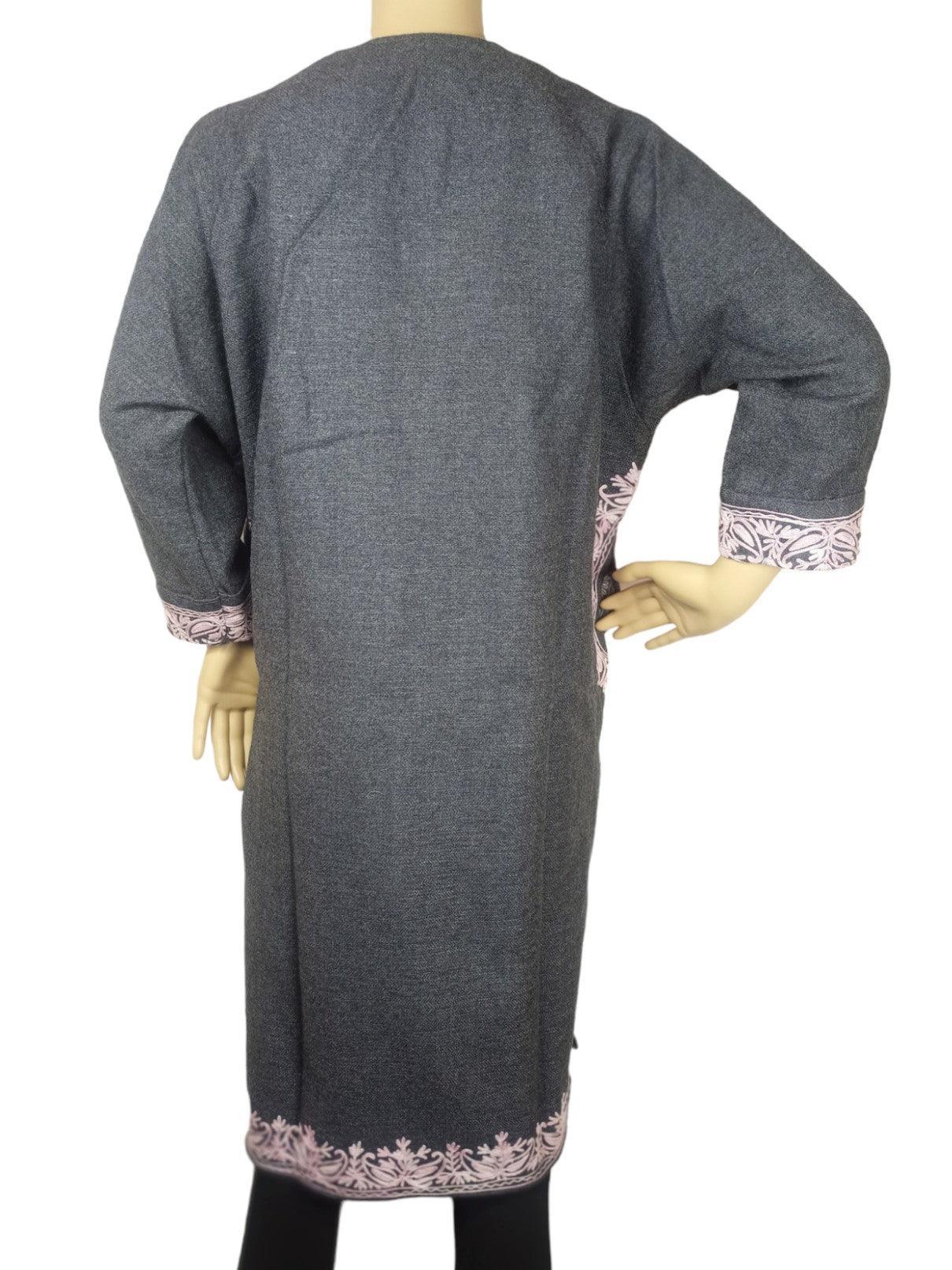 Back view of gray pashmina shawl with pink floral embroidery on cuffs and hem, worn by mannequin