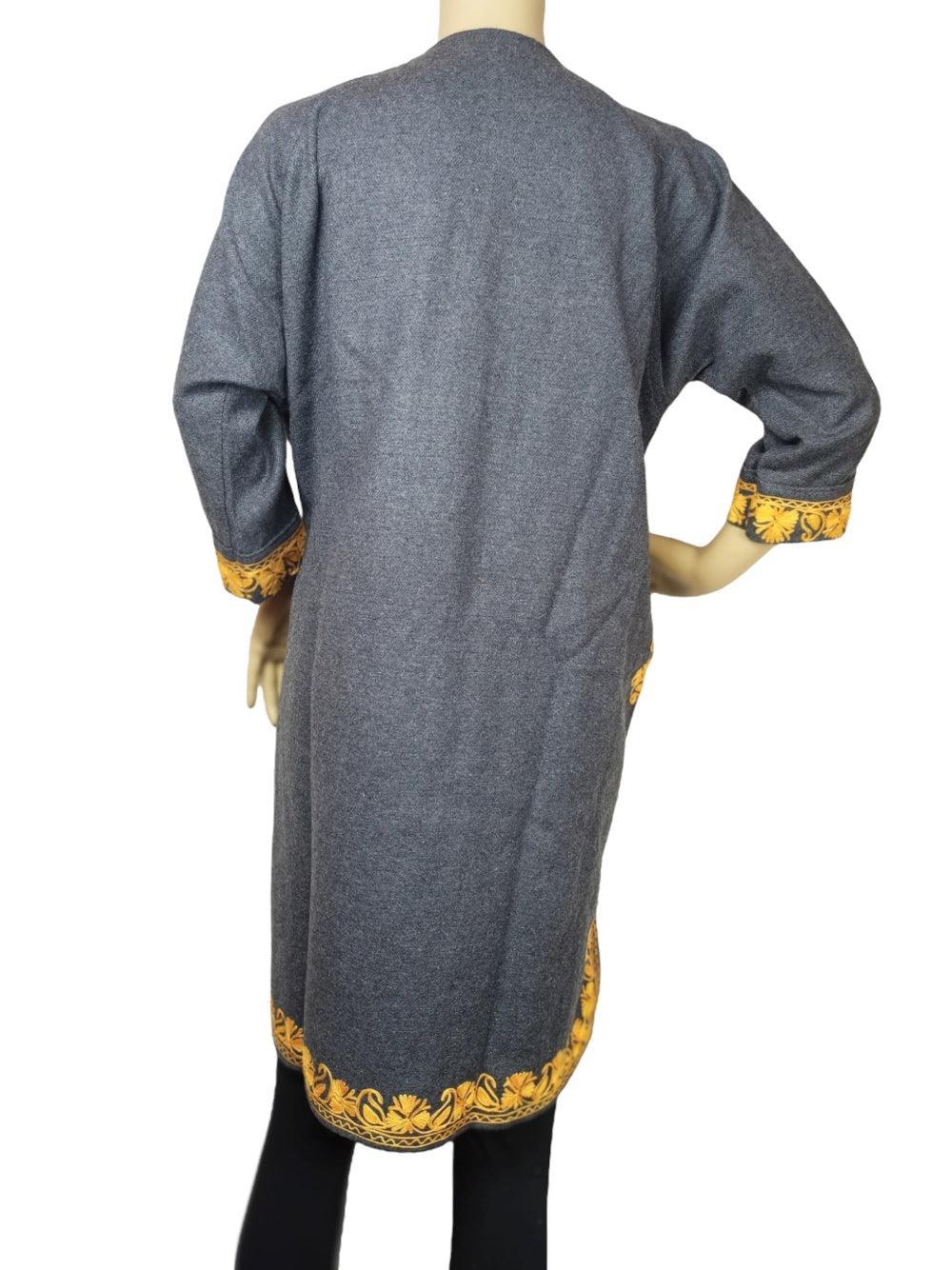 Back view of grey woolen coat with yellow floral embroidery on cuffs and hem, displayed on mannequin