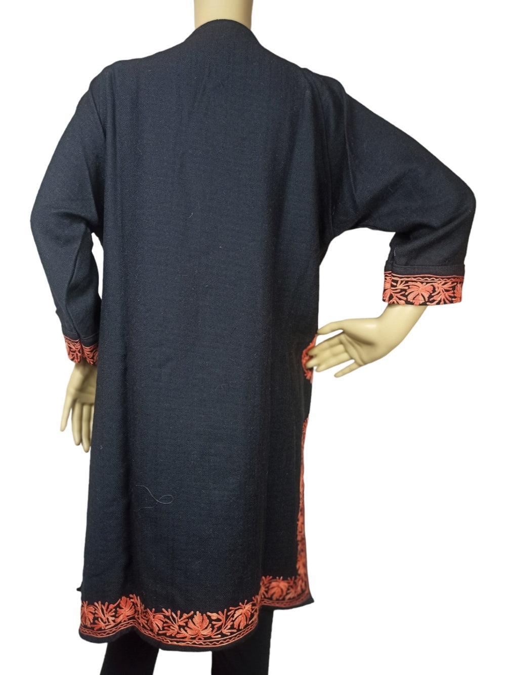 Black long sleeve woolen coat with orange floral embroidery on cuffs and hem, displayed on mannequin