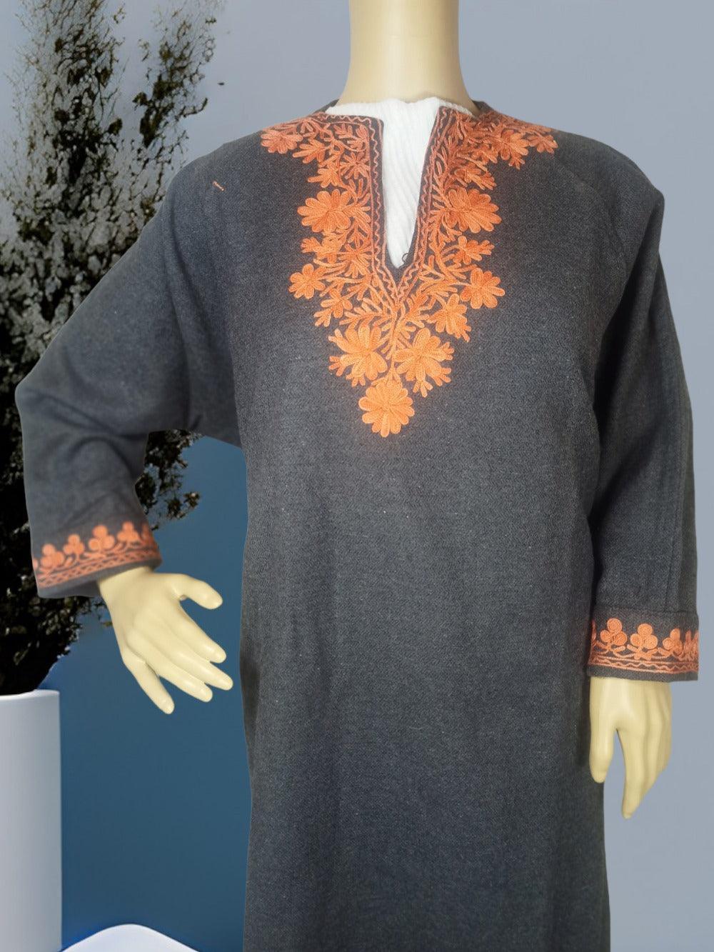 Gray Pashmina shawl with orange floral embroidery on neckline and cuffs displayed on mannequin