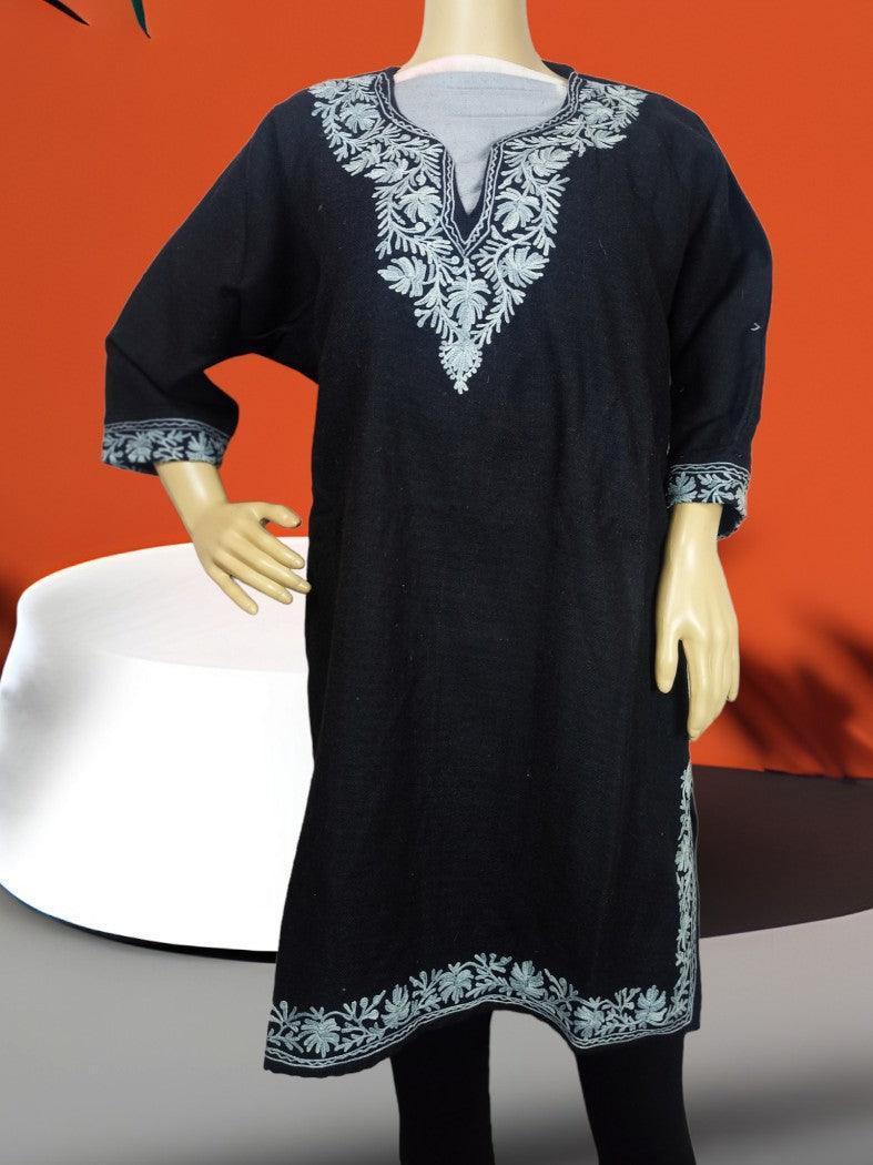 Black kurti with light blue floral embroidery on neckline, sleeves, and hem displayed on mannequin