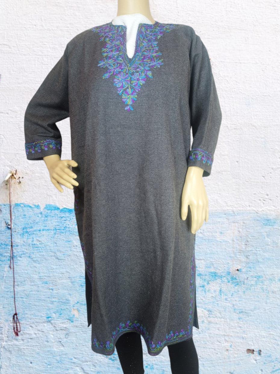 Grey woolen kurta with intricate blue and purple floral embroidery on neckline, sleeves, and hem on mannequin