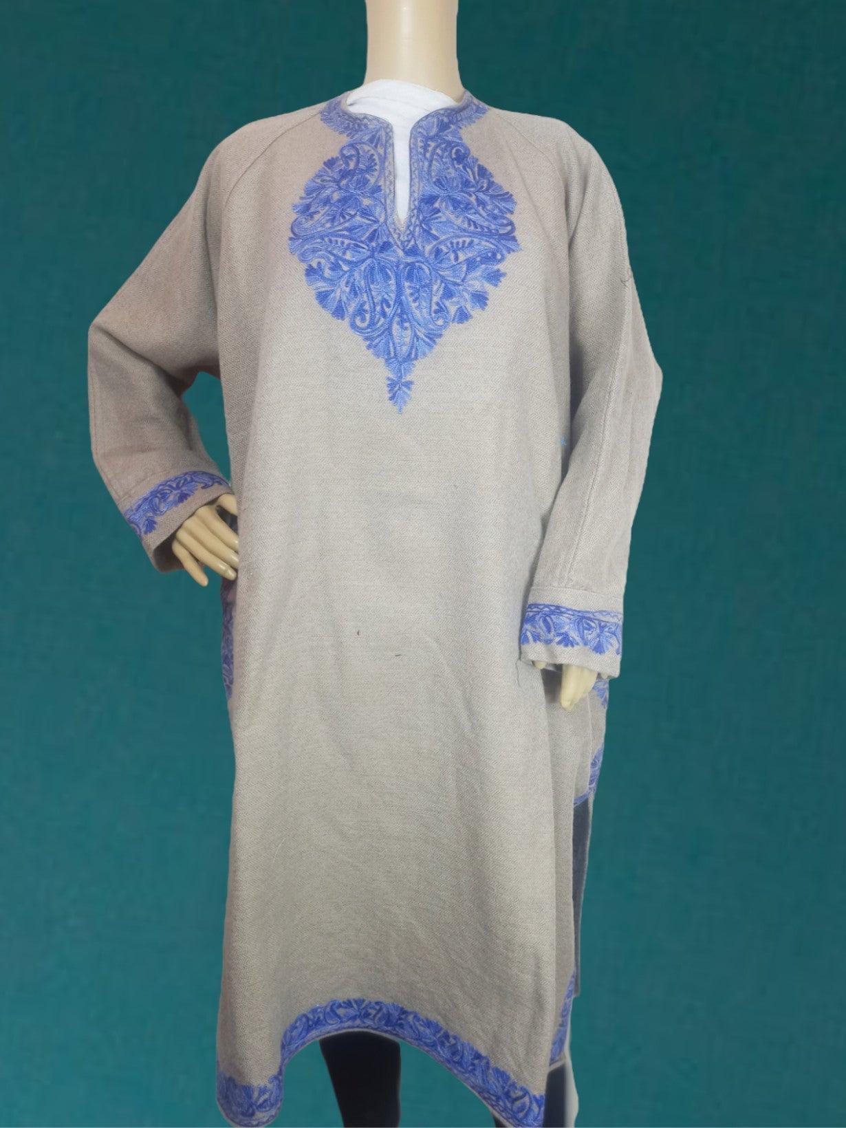 Beige traditional kurta with blue floral embroidery on neck, cuffs, and hem displayed on mannequin