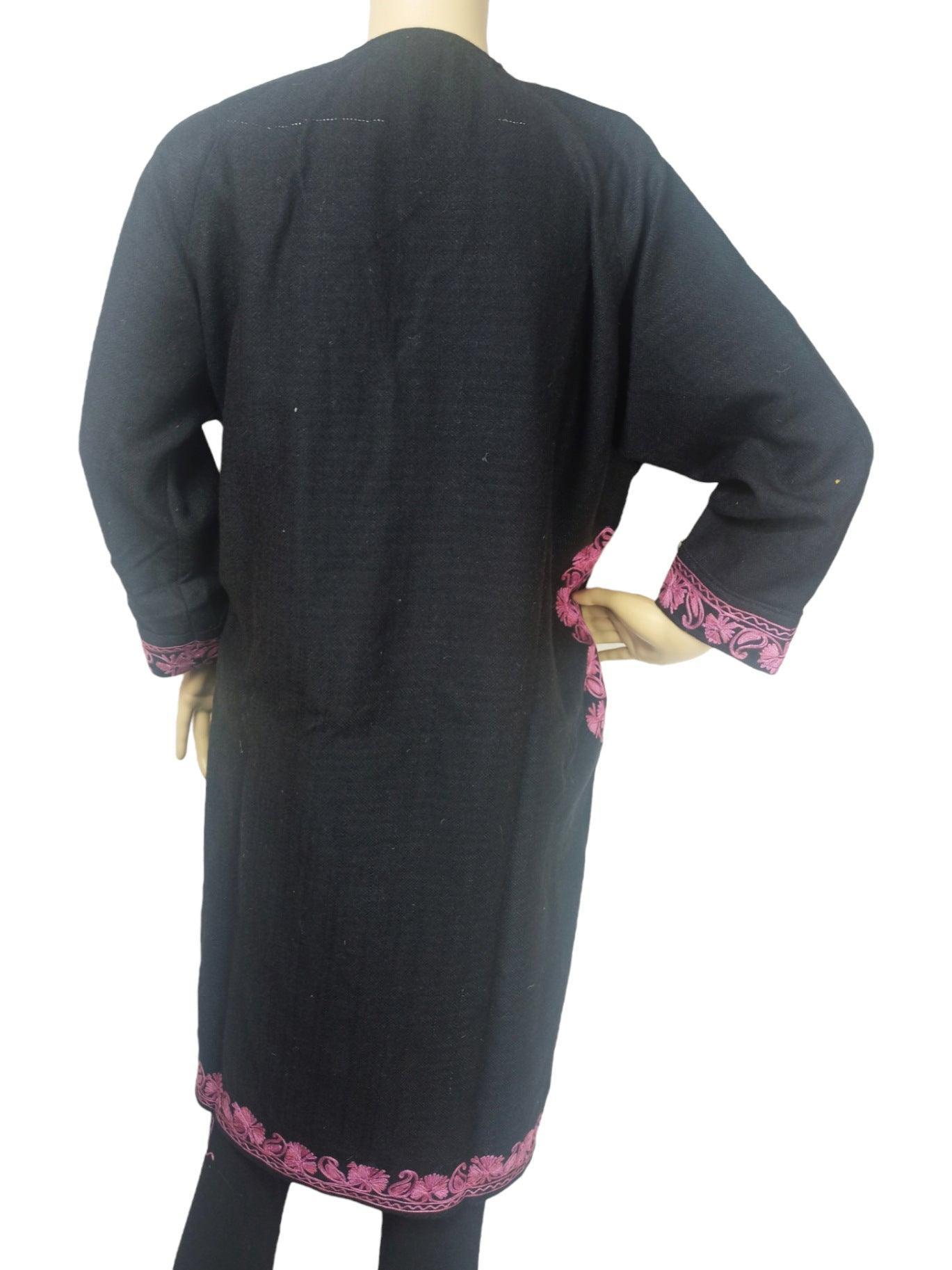 Back view of black kids yak wool faran pheran with pink floral embroidery on cuffs and hem by Zanskar Arts