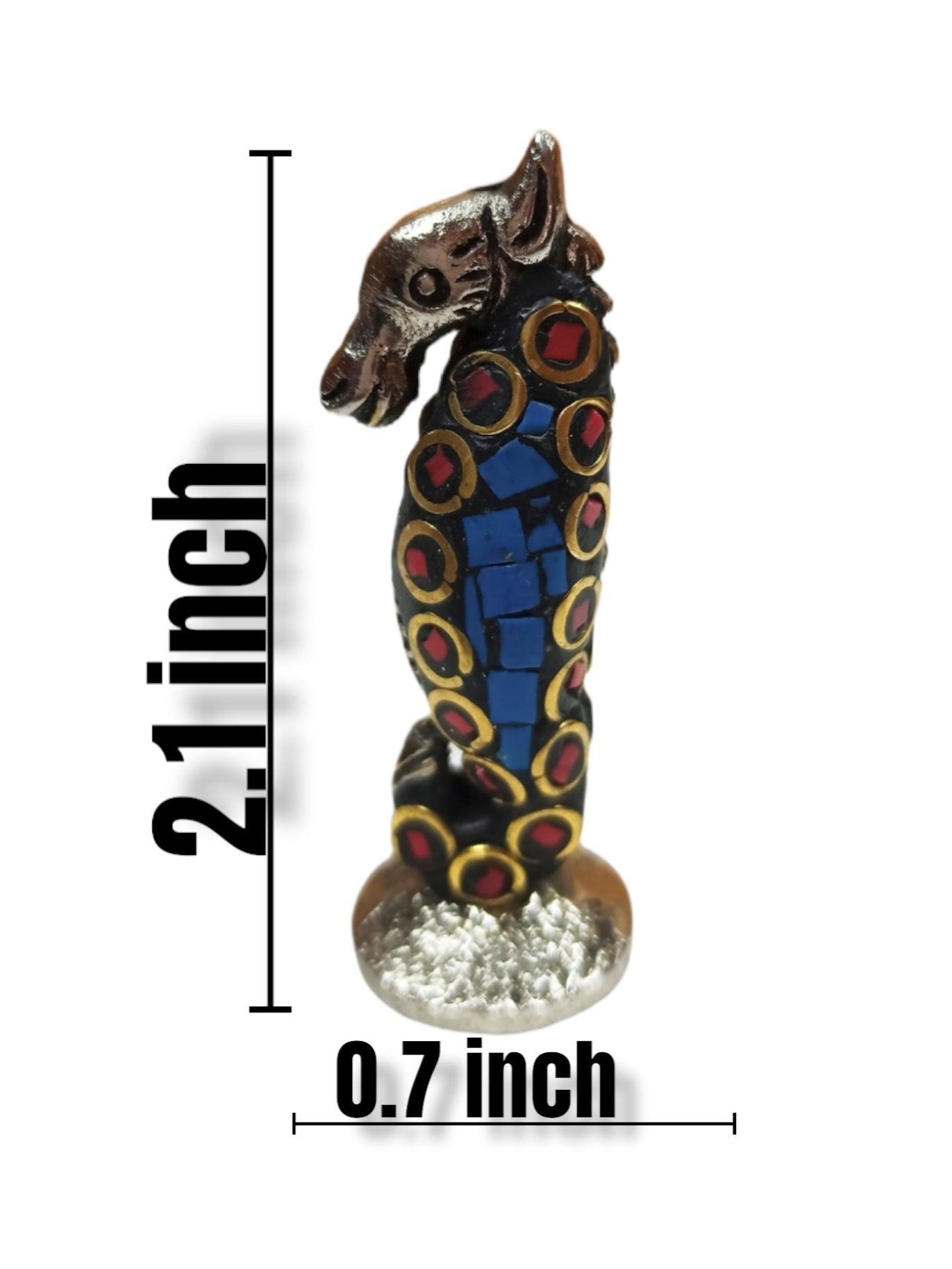 2.1 inch tall blue and gold seahorse incense holder with red accents on textured base