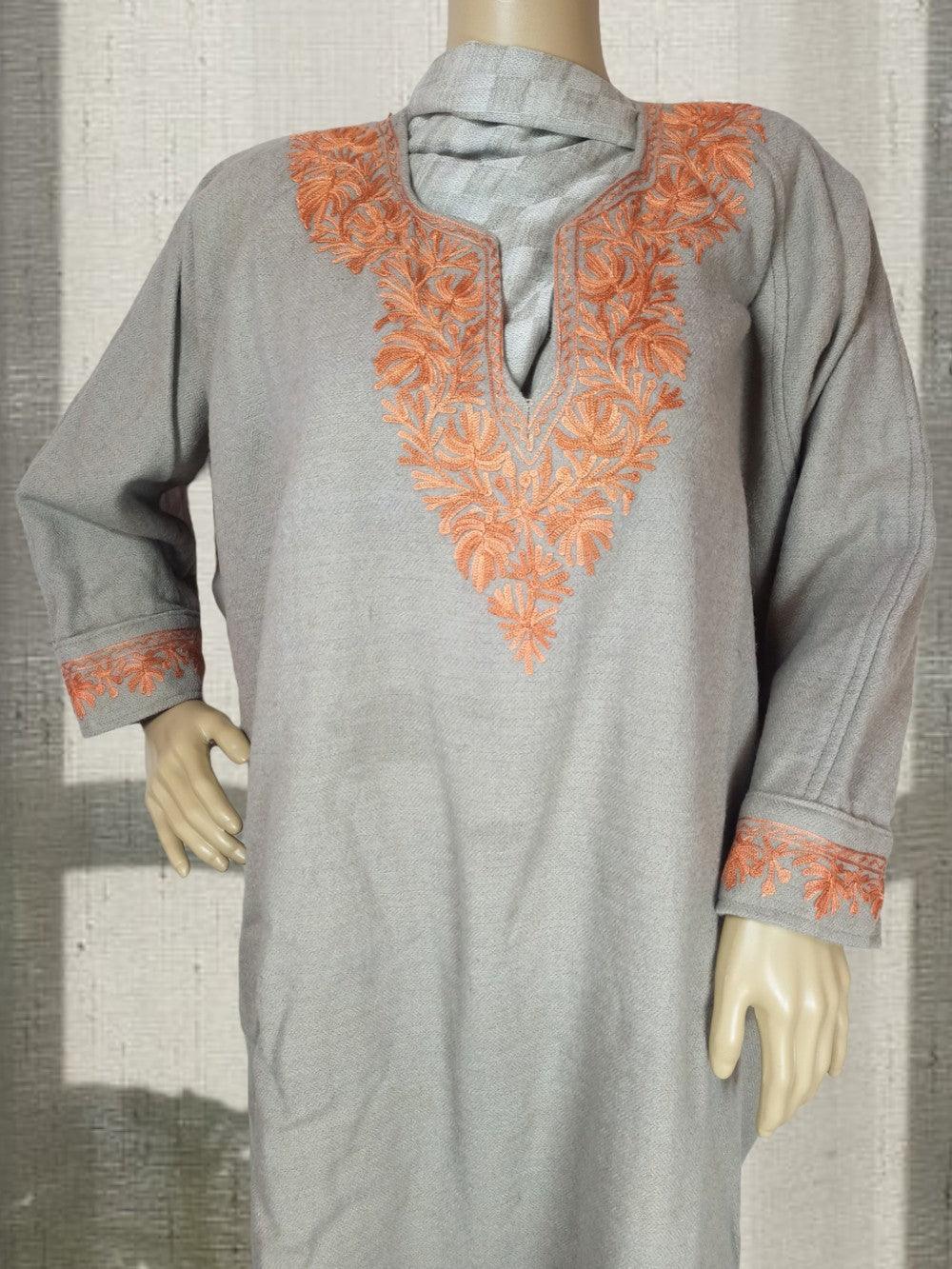 Cream-colored women’s yak wool faran with orange floral embroidery on neckline and cuffs