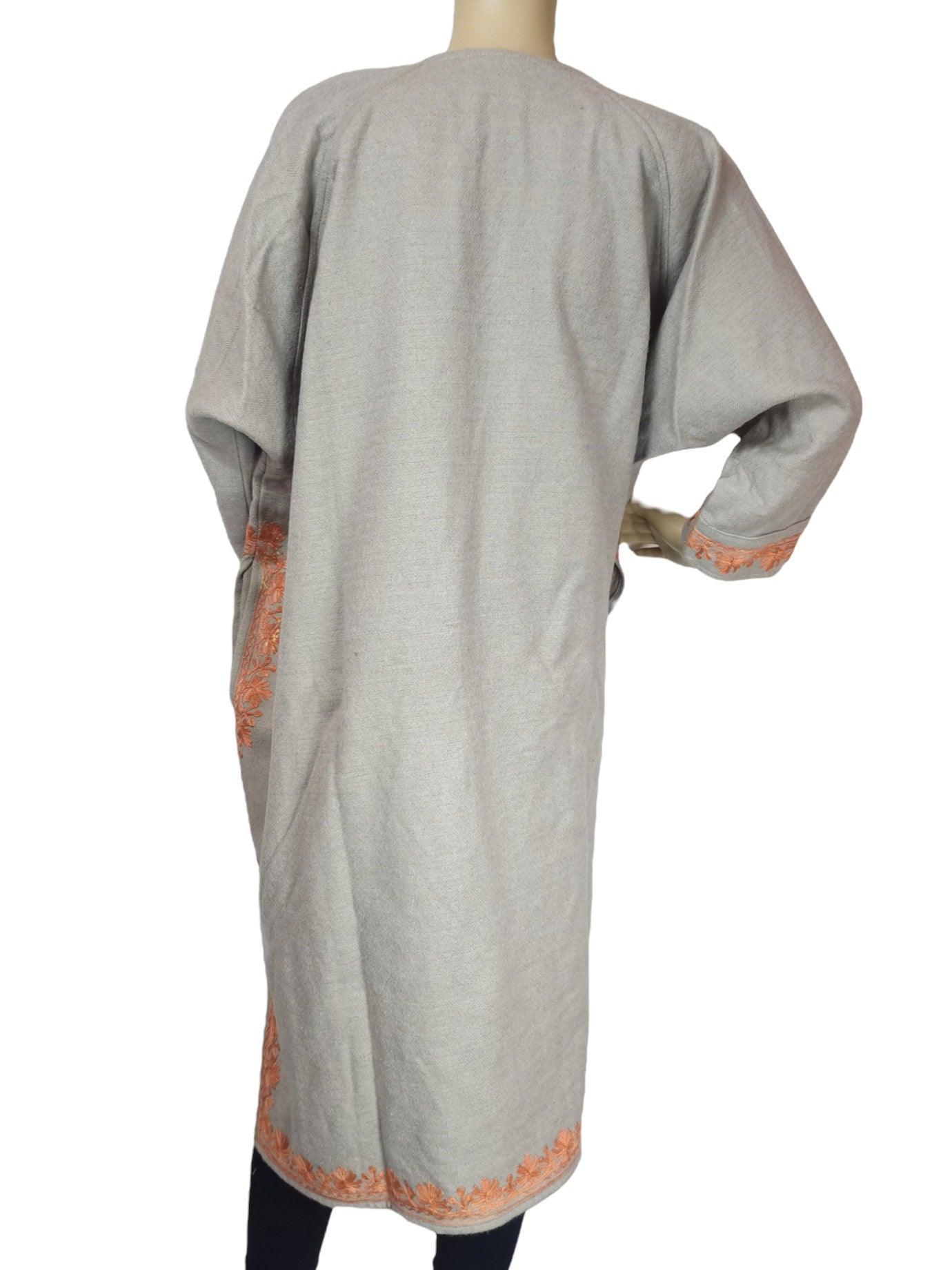 Women's cream yak wool faran coat with orange floral embroidery on cuffs and hem by Zanskar Arts