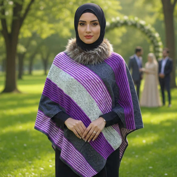 Woman wearing purple and gray striped pashmina shawl with fur collar and black hijab in green park