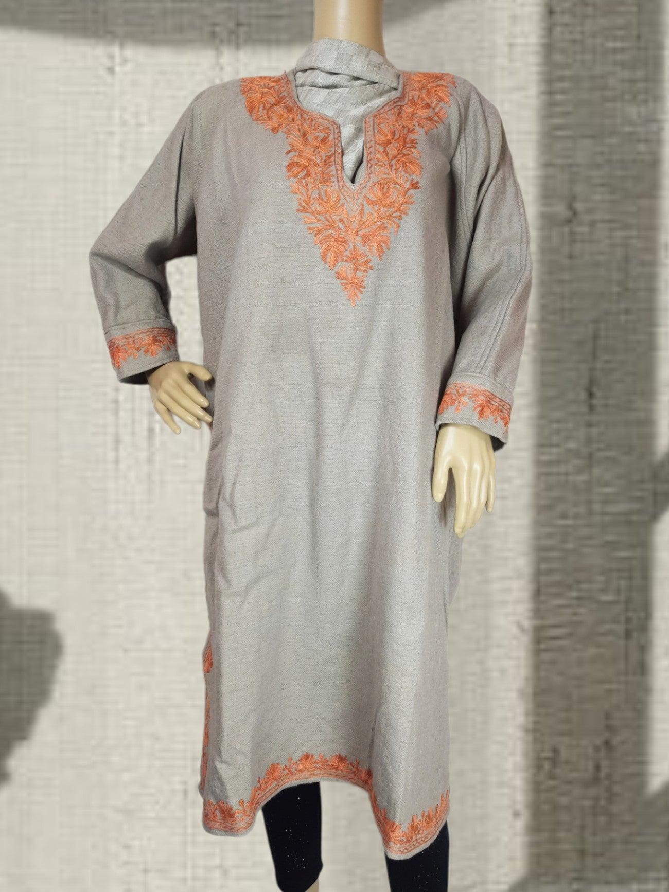 Grey traditional kurta with orange floral embroidery on neckline, cuffs, and hem displayed on mannequin