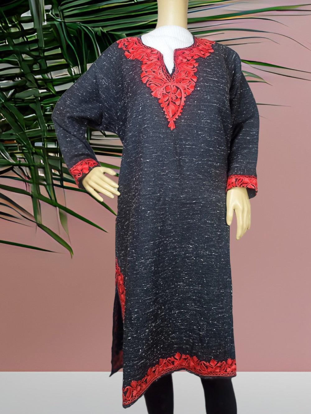 Black long kurta with intricate red embroidery on neckline, cuffs, and hem displayed on mannequin against pink wall and green palm leaves